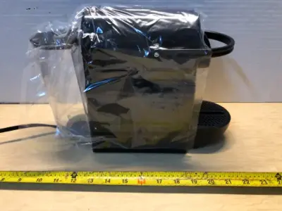 Nespresso coffee maker (comes on)