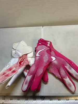 2 pairs of nike football gloves