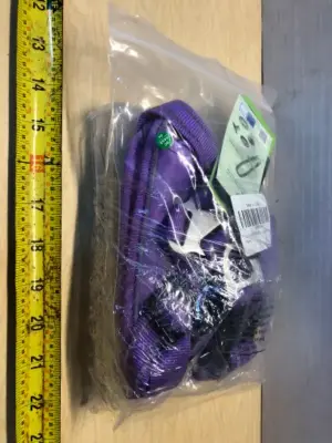 Large dog harness and box of dog combs