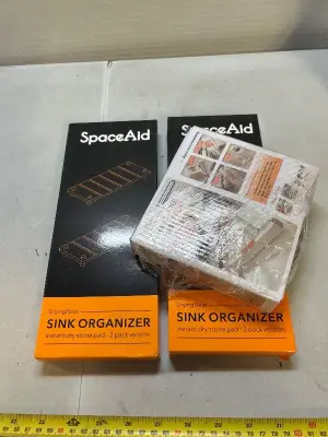 2 packs of sink organizers and 1 mini mop