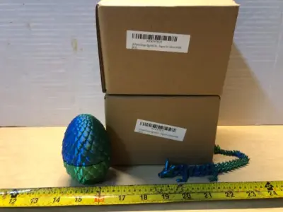 2 boxes 3D printed dragons and eggs four each box