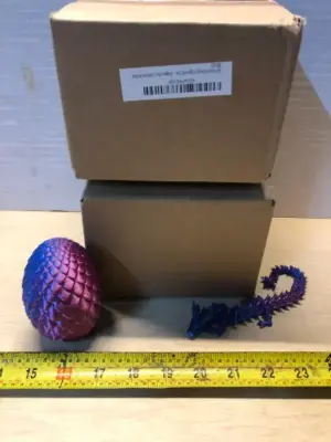2 boxes 3D printed dragon and egg four each box