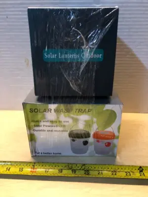 2 boxes solar wasp trap and a solar Lantern
