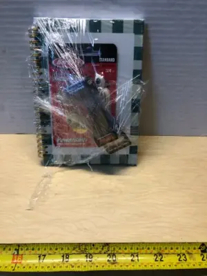 2 fishing lures and a fishing journal