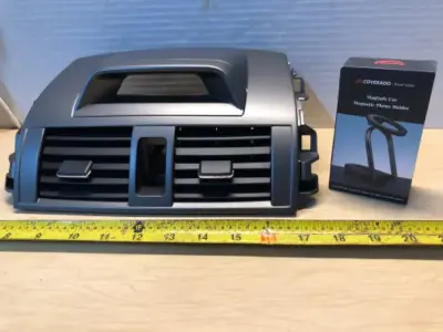 Upper dashboard unknown model vehicle, MagSafe magnetic phone holder