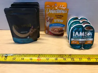 4 packs Reveal cat food exp:3/22/27, 2 pack’s delectables cat food exp:9/20/27, 3 packs IAMS cat food exp:9/23/27