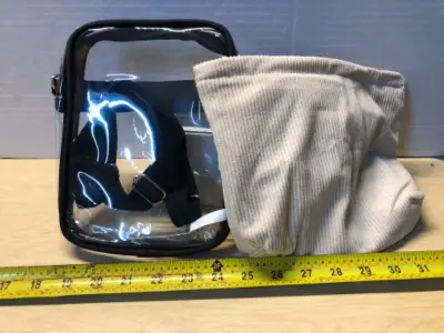 Clear cross body purse with 2 tan cosmetic bags