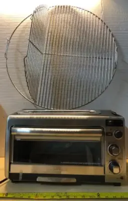 2in1 over and toaster dented  comes on , round wire rack