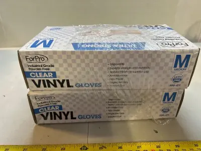 two packs of size medium clear vinyl gloves