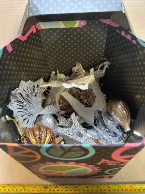 decorative box full of Christmas ornaments