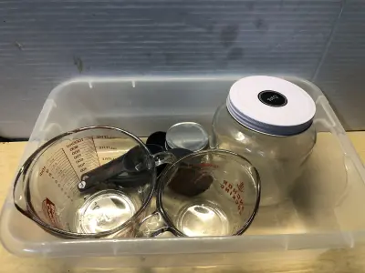Tub of kitchen utensils
