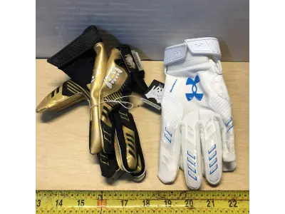 Under armor size large gloves gold and black, under armor size small gloves white and blue