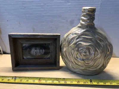 Wooden eye image and rose vase