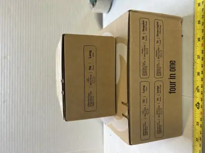 two boxes of 100% organic cotton pads