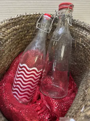 basket with two glass bottles, chipped paint