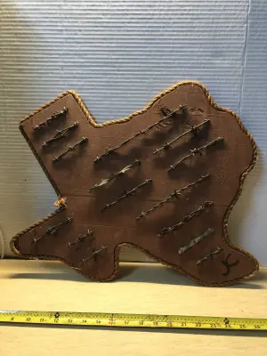 Wooden state of Texas with barb wire samples broken edge