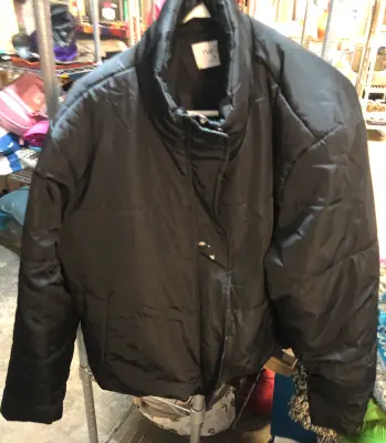 Rue 21 size XL black bubble jacket has white spot