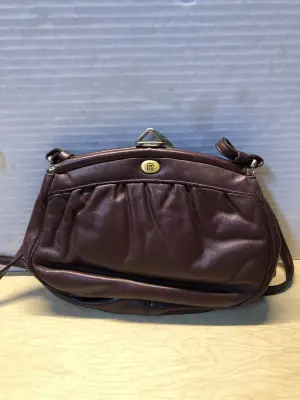vintage Etienne Aigner oxblood maroon leather shoulder bag with a brass logo closure