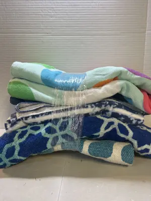 4 beach towels and a rug
