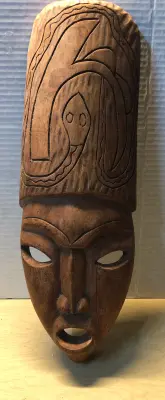 Wooden wall mask cracked on face