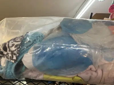 large bag of blanket, bath mats, sheets
