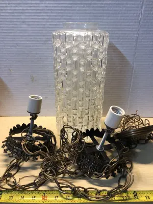 Light fixture missing one crystal globe