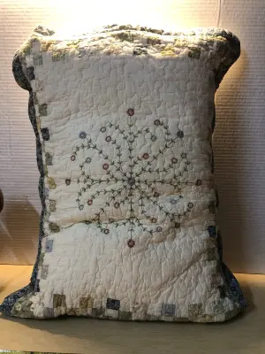 Pillow with quilted pillow sham