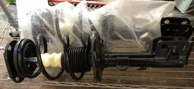 Front strut coil spring assembly unknown vehicle