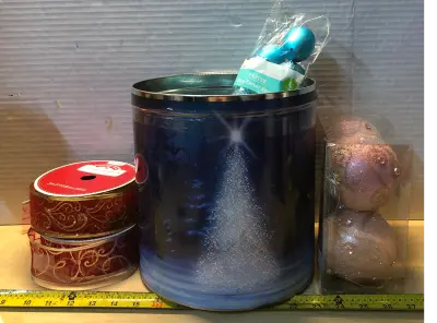 Christmas tin with 2 packs 75ft ribbon, 4 Christmas balls, 12 blue Easter eggs