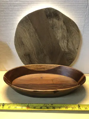 Oval wooden bowl and wooden cutting board