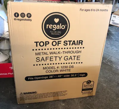 Top of the stair metal walk thru safety gate 28-42 wide and 30.5 high