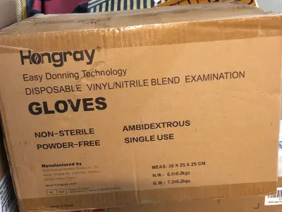 Box of medium sized vinyl powder free gloves
