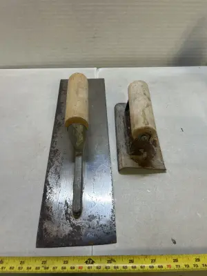 2 concrete scrapers