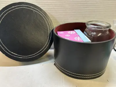 leather box with decorative jar and small box