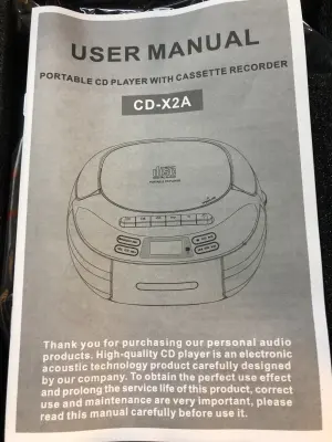 Portable Xs player with cassette recorder and remote