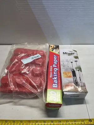 molds , baking paper , egg beater mixer