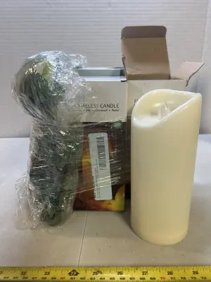 faux plant and 3 flameless candles