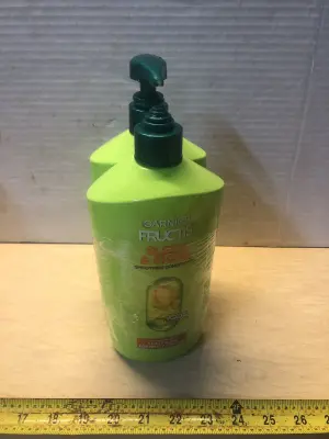 2 bottles 33.8oz Garnier Fructis conditioner one cap broke