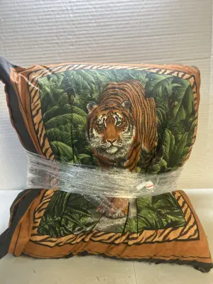 2 throw pillows 1 tiger 1 leather