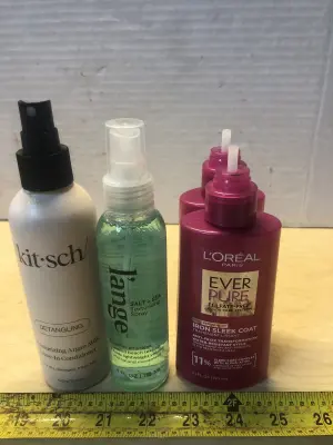 6.8oz kit•sch detangler spray, 4oz Lange texture spray , 2 bottles 5.1oz L’Oréal iron sleek coat caps broke