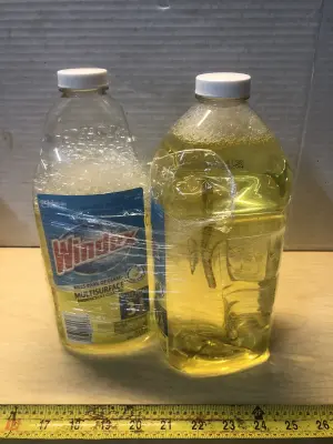 2 bottles 67.6oz windex multisurface disinfectant cleaner some spilled