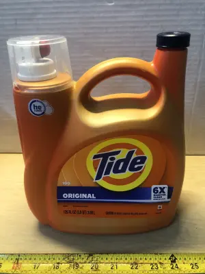 125oz Tide laundry detergent some spilled
