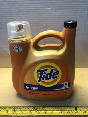 125oz Tide laundry detergent some spilled