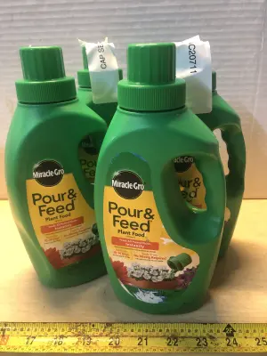 4 bottles 32oz Miracle Gro plant food