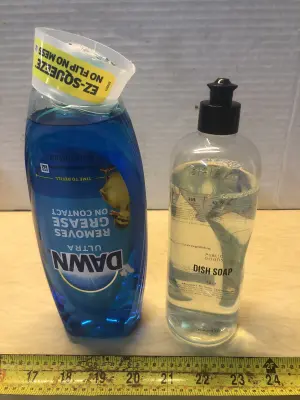 22oz Dawn dish liquid, 16oz Public goods dish soap some spilled
