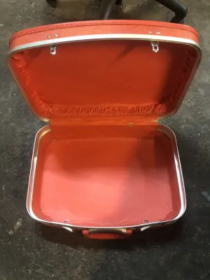Vintage suitcase has rips