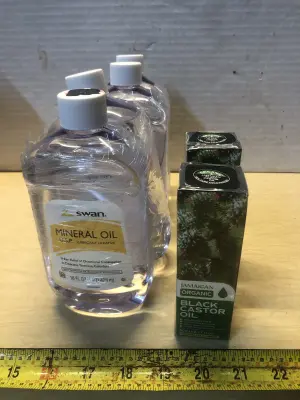 4 bottles 16oz Swan mineral oil, 2 boxes 2.11oz Jamaican organic black caster oil