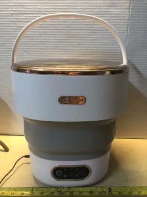 Foldable mini washer comes on