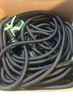 Black garden hose with sprayer unknown size used as is