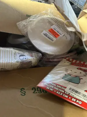 large box of various parties supplies